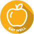 A circular golden-yellow icon featuring a clean white outline of an apple, with the words "EAT WELL" in bold white capital letters along the bottom curve.