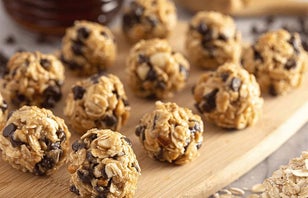 Bonus: They’re allergen-friendly!
PREP TIME: 30 min.    YIELD: 24 bites
Ingredients: 1.5 cup SunButter
1/4 cup Sunflower Seeds
1/2 cup Cranberries
1.5 cups Cereal
1/8 cup Chia Seeds
1/2 cup Mini Dark Chocolate Chips
Directions: 1. Add the ingredients to a mixing bowl , using a wooden spoon to stir well until combined and makes a dough.

2. Place the mixture in the freezer for 5-20 mins to chill and firm up.

3. Remove from freezer and use cookie dough scoop to 
scoop the dough. Roll into balls.

4. Store the energy bites in the fridge or freezer in an 
airtight container.