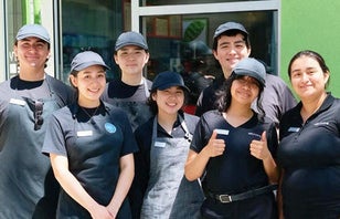 A group of smiling dining employees.