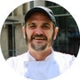 Chef with hat crossing arms