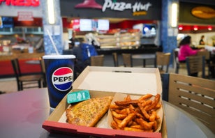 Pizza Hut Melt and fries with a drink in front of our Pizza Hut store location.
