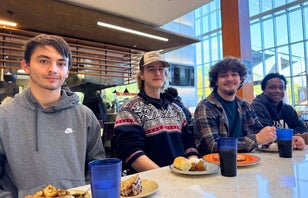 Students eating inside Broderick Dining Commons.