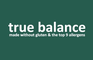 True Balance Logo.jpg: The "true balance" logo in white lowercase text on a dark forest-green background, with the tagline "made without gluten & the top 9 allergens.

