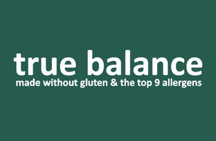 The "true balance" logo in white lowercase text on a dark forest-green background, with the tagline "made without gluten & the top 9 allergens."